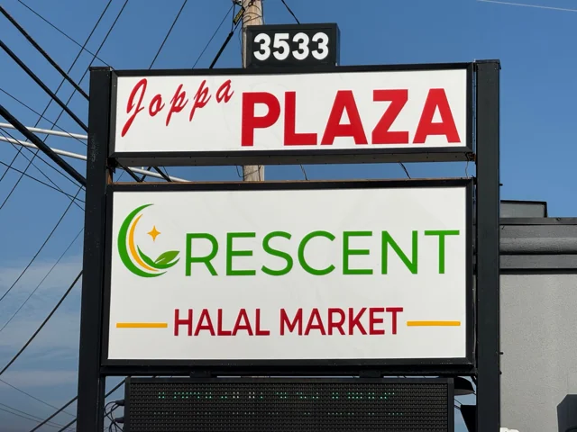 Joppa Plaza roadside sign with the Crescent Halal Market name and street number 3533